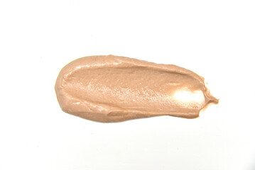 Smear of cream butter on a white background. Delicious diet peanut paste smear.