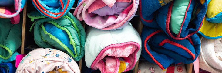 Panorama selection of rolled toddler nap mats school storage cabinet at preschool kindergarten,...
