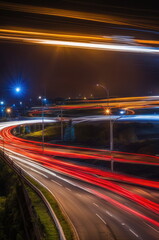 Fototapeta na wymiar Serpentine Urban Freeway at Night