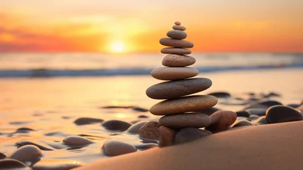 Cercles muraux Pierres dans le sable balance stack of zen stones on beach during an emotional and peaceful sunset, golden hour on the beach