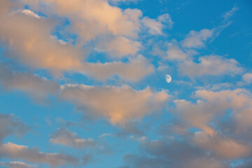 Beautiful sunset sky background with clouds. Scenic cloudscape.