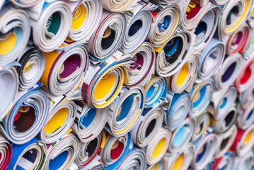 Colorful rolled up old paper magazines