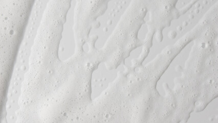 Abstract background white soapy foam texture. Shampoo foam with bubbles