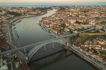 Ethereal Elegance: A Breathtaking Aerial Portrait of Dom Luís I Bridge Spanning Majestic Douro River