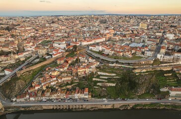 Unveiling the Majestic Tapestry: A Poetic Aerial Spectacle of Portos Cascading River and Vibrant Urban Symphony