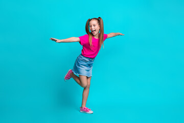 Full size portrait of overjoyed adorable positive girl arms wings rejoice isolated on turquoise color background