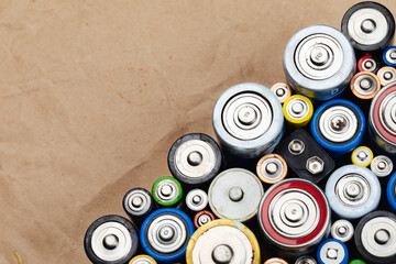 Assorted Used Batteries on a Brown Paper