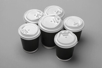 Disposable paper cups with plastic lids. Coffee cups to takeaway. Eco friendly packaging. Recyclable material.