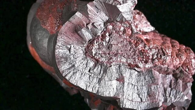 Hematite / Haematite (principal ore of iron) 'kidney ore' - sample rotating slowly against a black background.