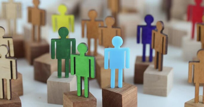 Multi-colored wooden figurines of people. LGBT community concept