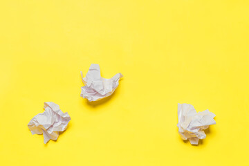 Office Supplies: Tangled White Documents on Yellow Surface