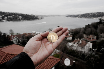 symbolic bitcoin money in my hand or on the rock