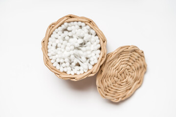 Organic Wicker Tray: Paper Wicker Basket Container for Cotton Buds on white Surface. Top view