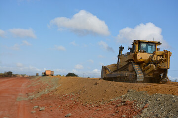 construction machines at works, dozer, roller machine, excavator, crawler rock drill machine, trucks, GPS grader