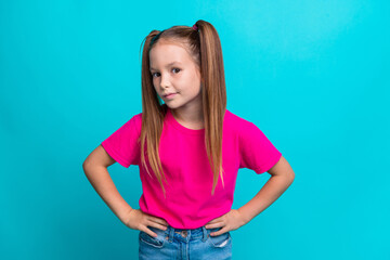 Photo of funky schoolchild put hands waist listen interested chatting isolated on cyan color...