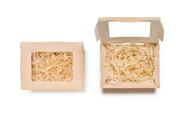 Top View of Pair of Cardboard Boxes, One Unsealed, One Sealed, with Paper Filler on White Background