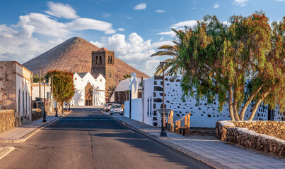 Experience the serene beauty of La Candelaria Church in La Oliva, Fuerteventura, nestled under a...