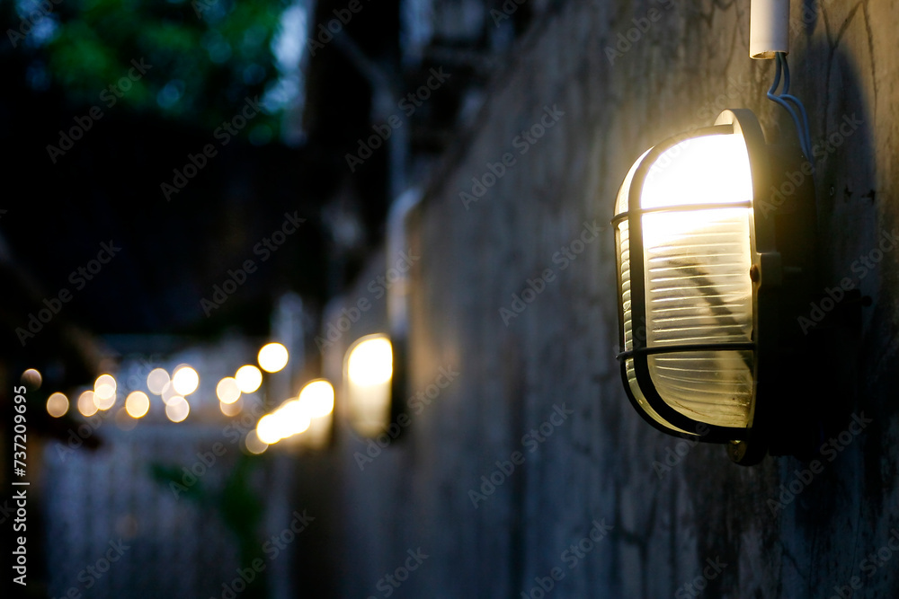 Wall mural close up of outdoor lighting lamp at evening