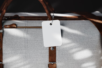 Luggage tag hangs on bag handle mockup. 3D rendering 