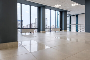 panorama view in empty modern hall with columns, doors and panoramic windows.