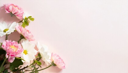 Fototapeta na wymiar Beautiful spring flowers on light pink background. Top view
