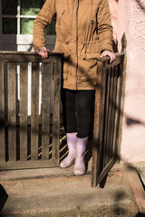 girl on the threshold of the house