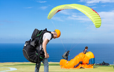 Men preparing to paraglide