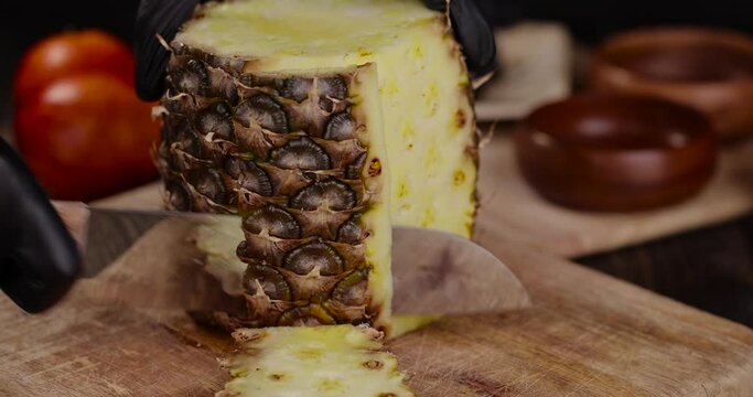 a delicious ripe pineapple yellow, pieces of sweet and juicy pineapple cut on a cutting board