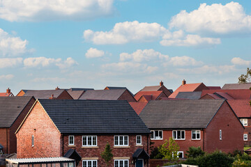 Houses in England with typical red bricks on a sunny day