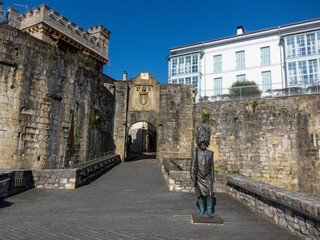 Entrance through the old part of the tourist town of Hondarribia surrounded by a large medieval...