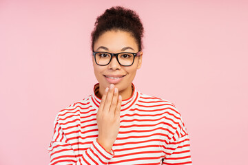 Attractive smiling African American woman wearing stylish eyeglasses speaking with sign language