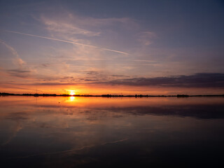 Obraz premium Sunset over De Morra lake in summer, Friesland, Netherlands