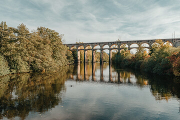 Railway Bridge with river in Bietigheim-Bissingen, Germany. Autumn. Railway viaduct over the Enz...