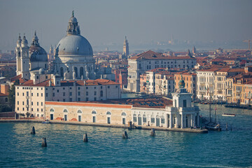Punta della Dogana and Basilica Santa Maria della Salute at the entrance of Grand Canal in Venice, as seen from San Giorgio Maggiore - obrazy, fototapety, plakaty