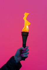 a person holding a torch in front of a pink backgroun