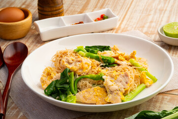 Stir fried Rice Vermicelli with sliced chicken breast,stir fried noodle with garlic ,Sweet Black Soy Sauce ,kale and egg with soy sauce (Pad See Ew).Thai style healthy low fat food.