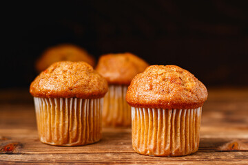 Carrot mini muffins on rustic wood