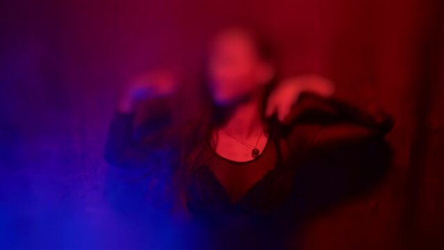 Passion desire temptation concept. Sexual excitement arousal abstinence. Lady of the night in sexy lingerie erotically stroking body by hands. Hot mistress. Intimate. One-night stand. Tilt-shift blur