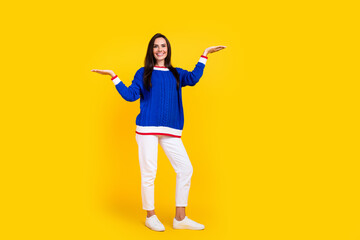 Full length size photo of happy brunette model compare offer raised arms better choice more advantages isolated on yellow color background