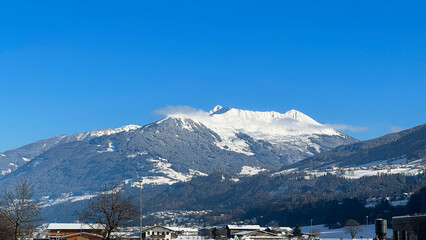 Scenic view of a snow-capped mountain peak, Austria. A winter wonderland in the Austrian Alps....