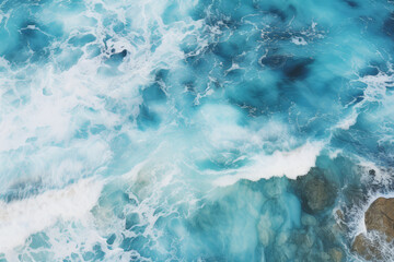 Fototapeta premium Top view of blue frothy sea surface. Shot in the open sea from above.