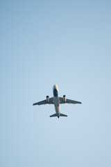 Commercial Airplane Ascending Against Clear Blue Sky