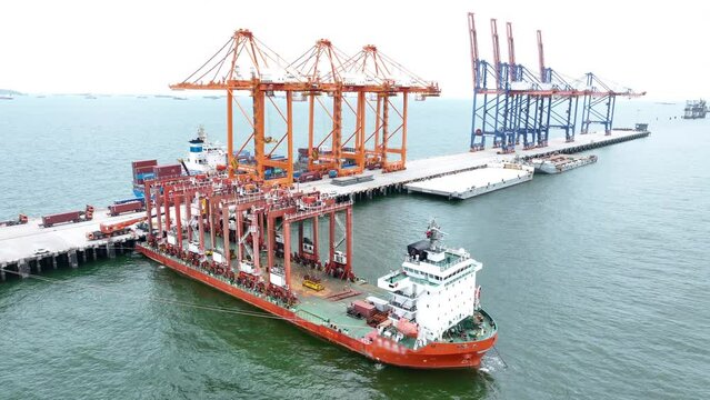 Big Construction Crane on barge ship. container crane on Barge Ship transportation to cargo international sea port.