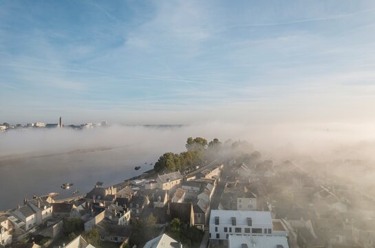 Mystical Metropolis: A Captivating Birds Eye Glimpse Into a Fog-Enshrouded Cityscape