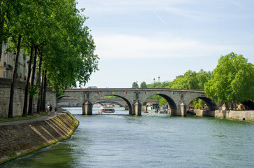 Paris, France, 30 may 2023. Travel in summer on a river boat along the Seine River in the center of city and see the sights, buildings and bridges