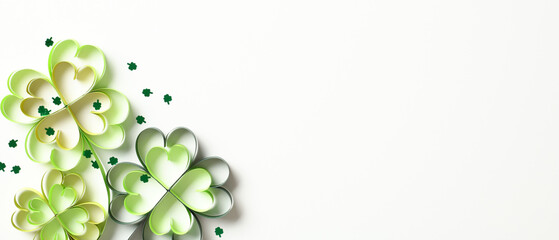 Paper four leaf clover with confetti on white background. St Patrick's Day banner design. - obrazy, fototapety, plakaty