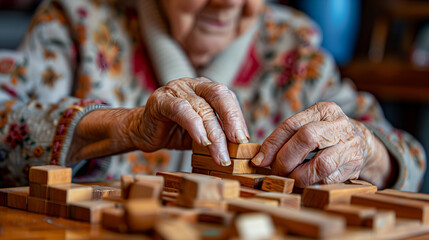 Elderly woman playing with wooden blocks in a geriatric clinic or nursing home