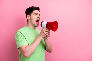 Photo of young furious man bossy screaming loud speaker to empty space announce ukrainian public...