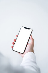 hand holding smart phone with screen