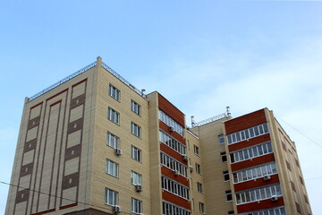 There is a high-rise building against the blue sky.